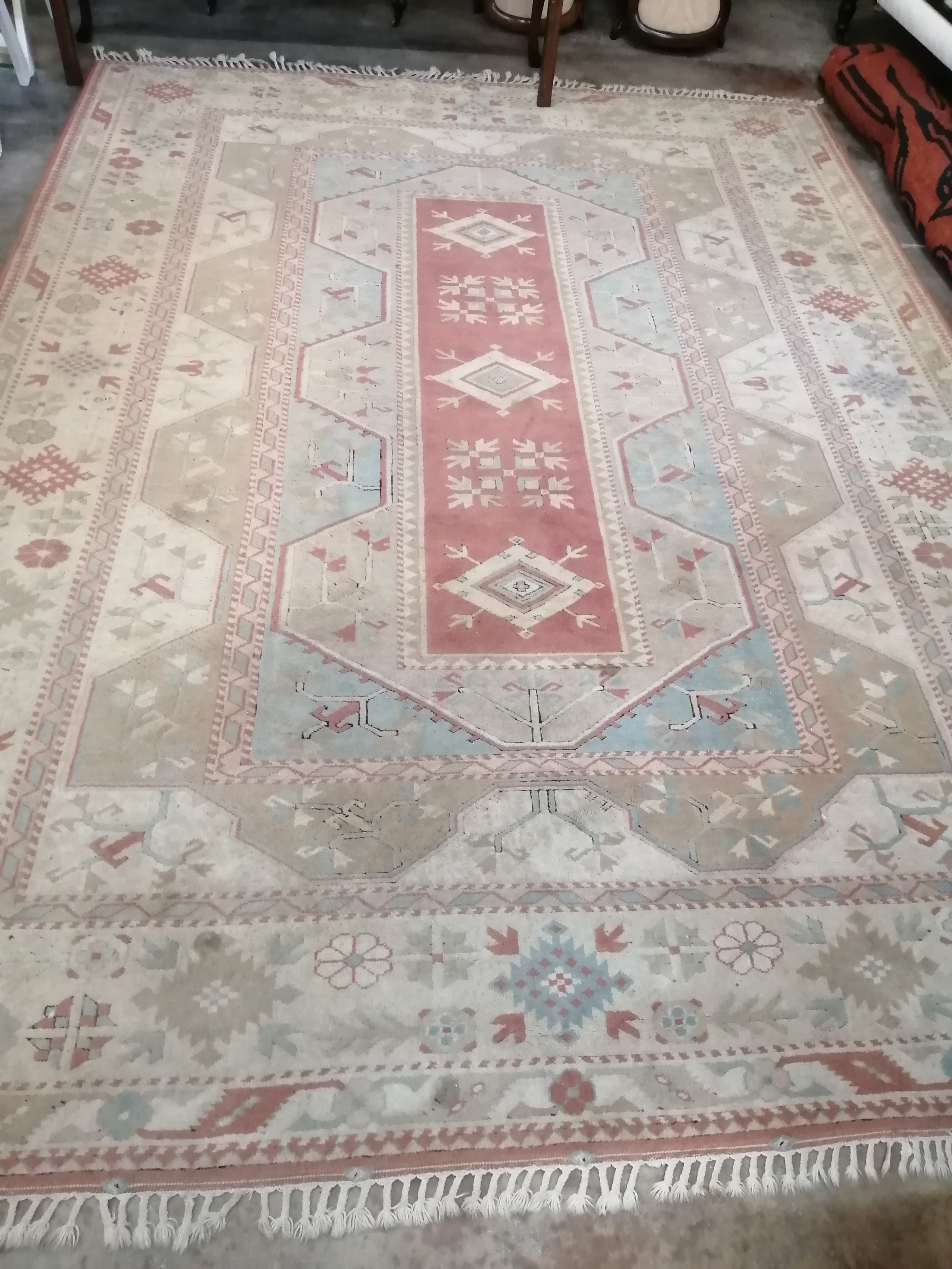 A Caucasion style polychrome geometric carpet, 360 x 260cm